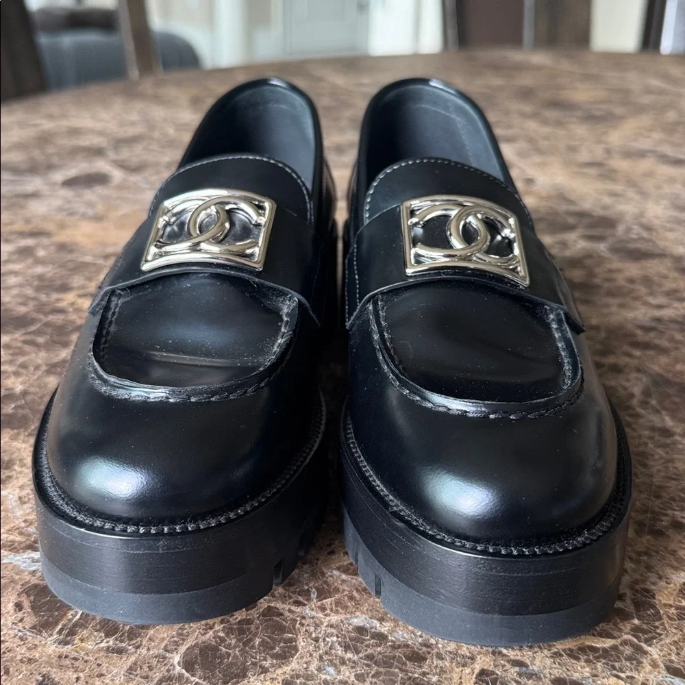 Chanel black shiny calf loafers moccasins chunky flats silver logo sz 37.5